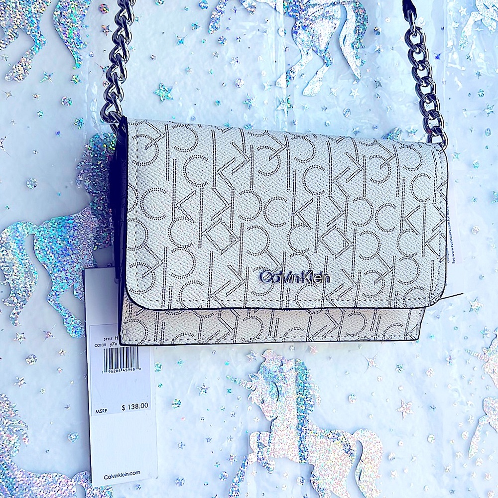 Very sleek beautiful brand new handbag cross body great for phone card lipsticks